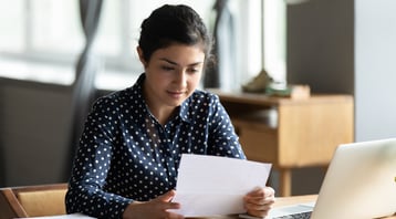 Businesswoman reading a letter